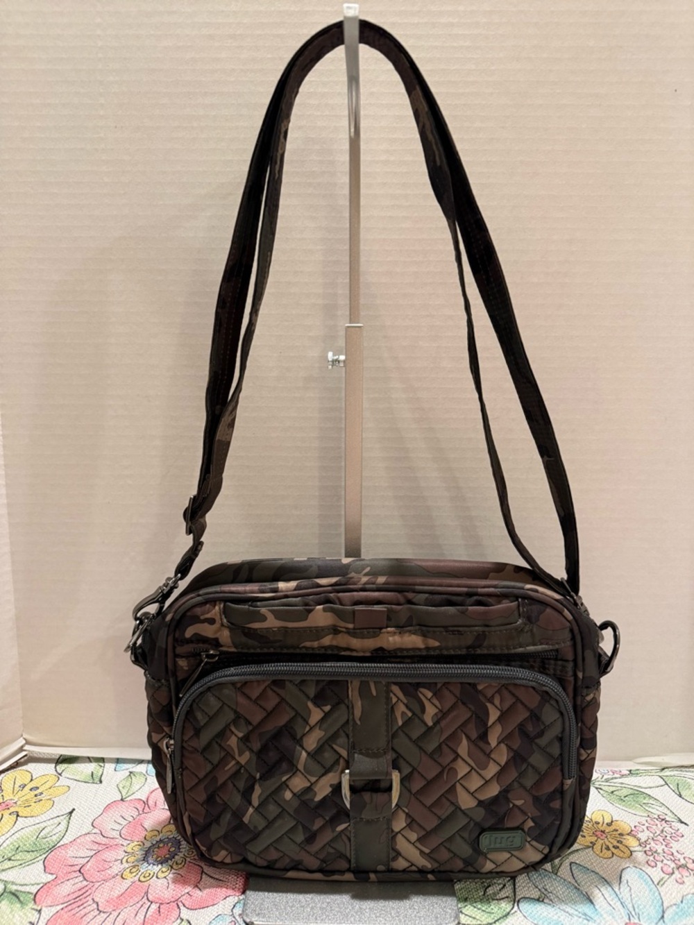 Lug Carousel XL Convertible Crossbody Bag in a Camo Green pattern.